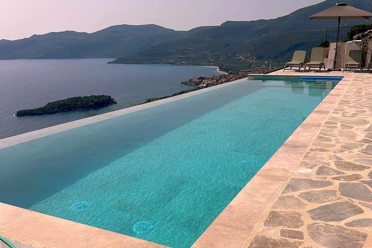 The full 13-metre length of the pool from the shallow end, with the bay below.