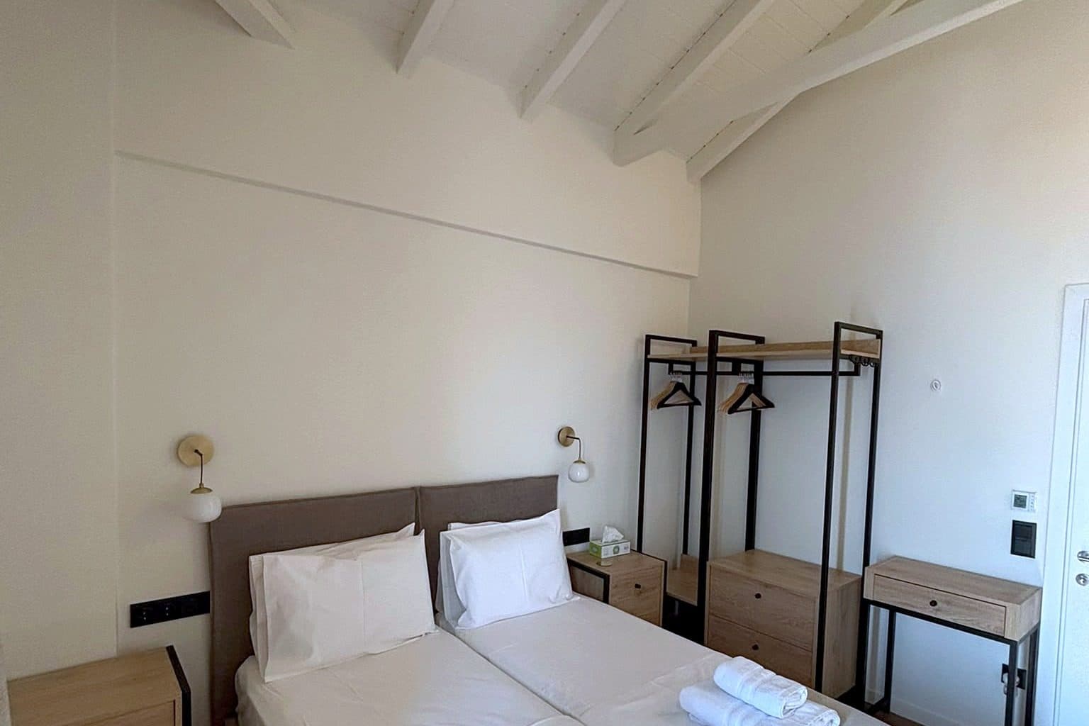 The second bedroom on the upper floor, with twin aspect windows.