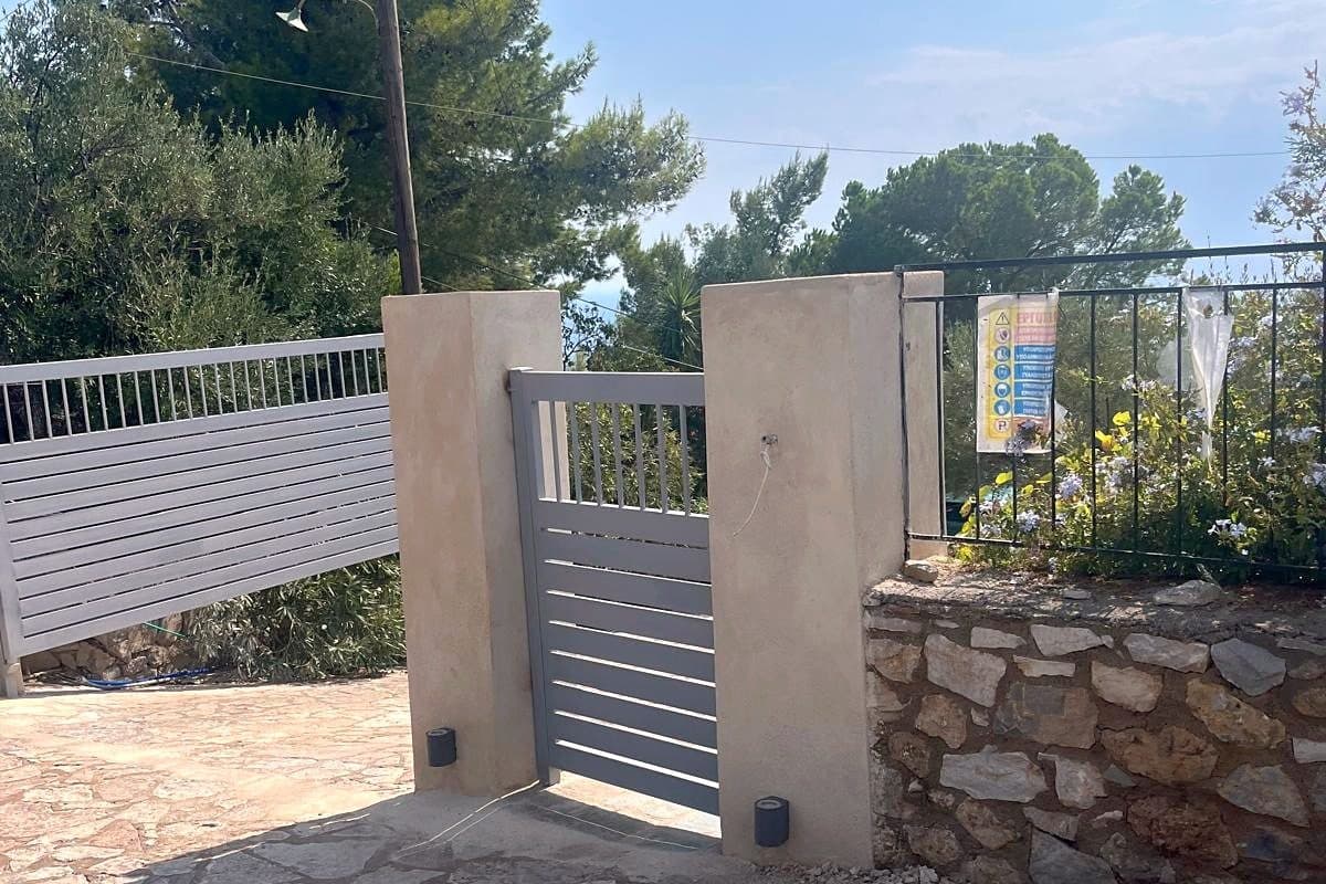 The gated entrance to the property from the lane.